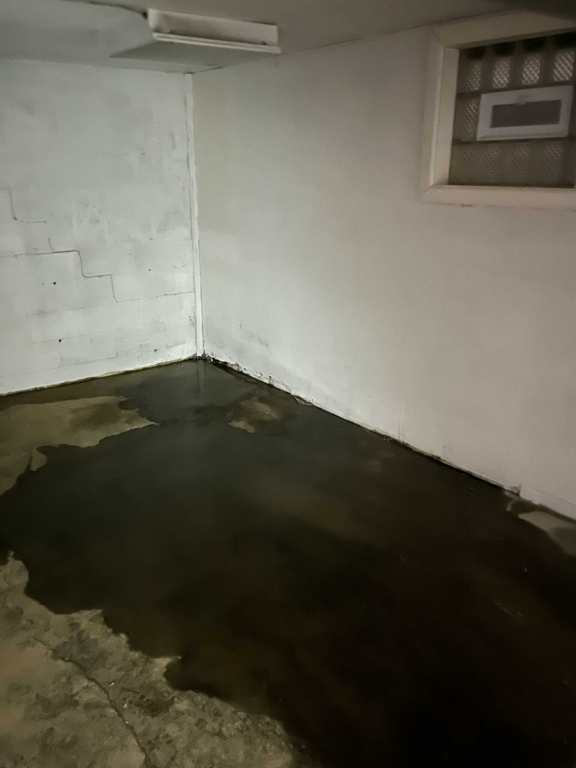 Standing water and damage in a Western Pennsylvania basement